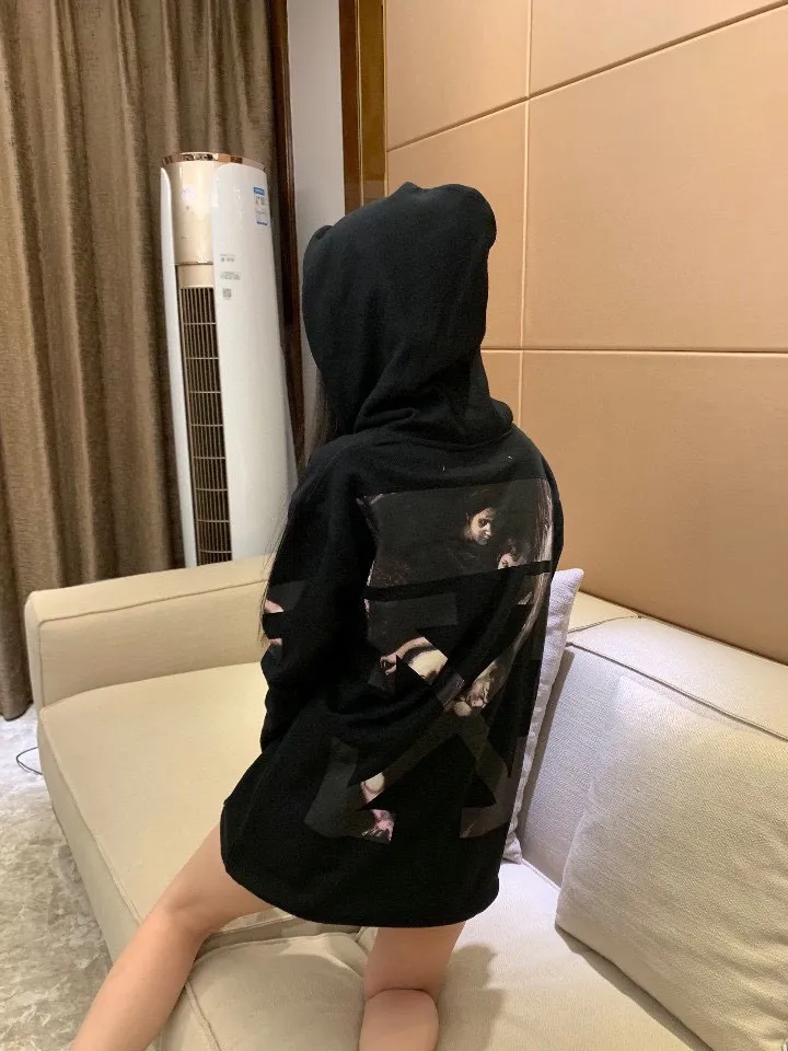 ♻️💯Reference model picture for the upper body❤️ Top tested version OFF WHITE OW Certified Angel Wings Madonna religious oil painting men's and women's round neck zipper cardigan sweatshirt. The A mark on the collar is a 3M reflective mark, customized model, not an embroidery mark, first look at the appraisal.  The Renaissance-themed Caravaggio Madonna oil painting is inspired by one of Caravaggio's famous oil paintings, with a strong religious color! World treasures, top-notch paintings, and walking art pieces follow the original craftsmanship and use 5-color glue to create an effect. It is not offset printing, but many people on the market use Kornit direct inkjet instead. Whether it is the top version, touch the printing with your hand. The correct process is that it has a frosted feel. This is also a way to identify the uniqueness of the product. The fabric is 100% combed cotton terry fabric, 480 grams, ensuring the originality of the craftsmanship! Secondly, the tag rope of this model hangs from the collar tag, not the side rope. Customized auxiliary materials, complete accessories, consistent zp, hang tags, collar labels, and washed labels, feel free to compare!   Color: Black White Size Chart